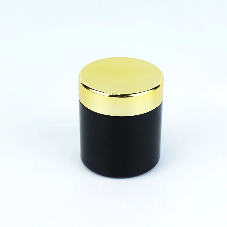 Black color child resistant glass jar with gold lid Black color child resistant glass jar with gold lid