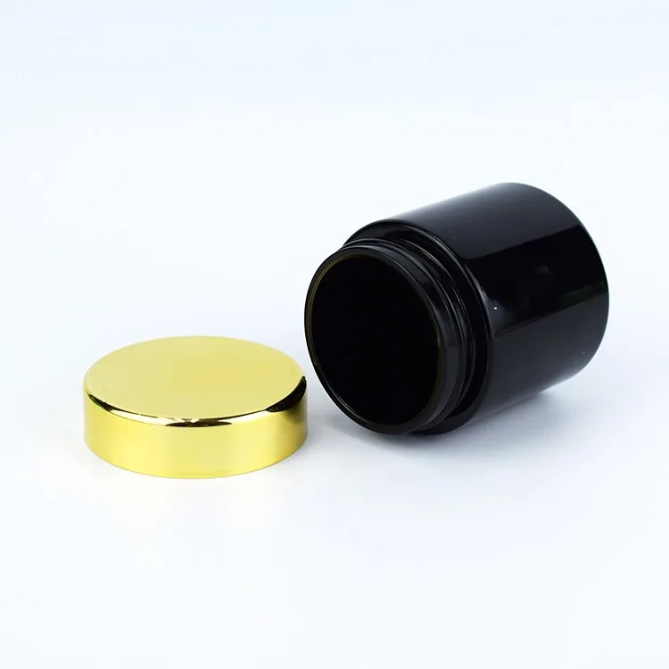 Black color child resistant glass jar with gold lid Black color child resistant glass jar with gold lid