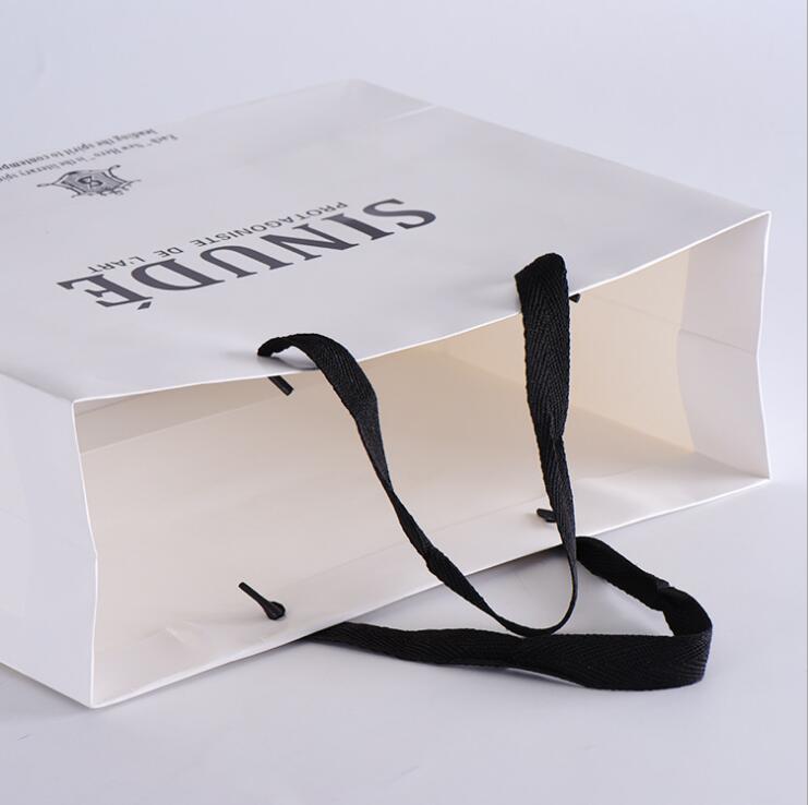Customized kraft paper shopping bag Customized kraft paper shopping bag