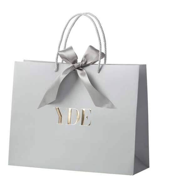 Art paper bag with ribbon closure Art paper bag with ribbon closure