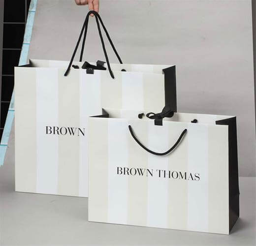 Art paper bag with ribbon closure kraft paper bag with ribbon closure