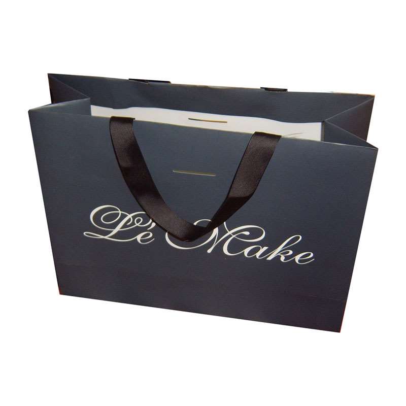 Shopping paper bag with rope handles for clothing packaging Shopping paper bag with rope handles for clothing packaging
