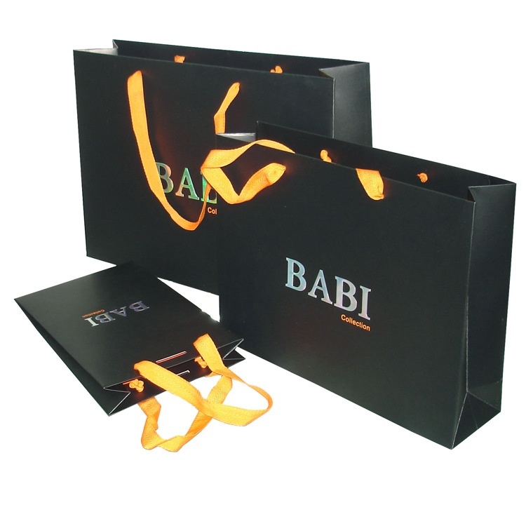 Shopping paper bag with rope handles for clothing packaging Shopping paper bag with rope handles for clothing packaging-katady.com