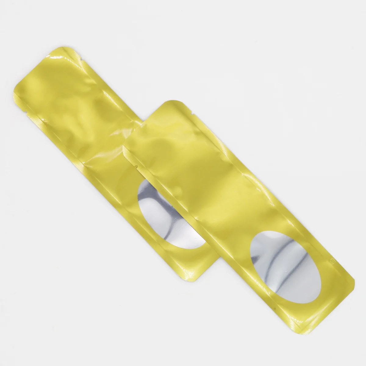 Metallized Stick Pouch with Rounded Corners and Oval Window Metallized Stick Pouch with Rounded Corners and Oval Window