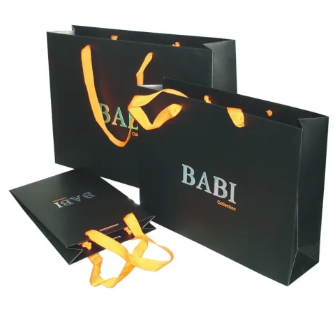 Shopping paper bag with rope handles for clothing packaging